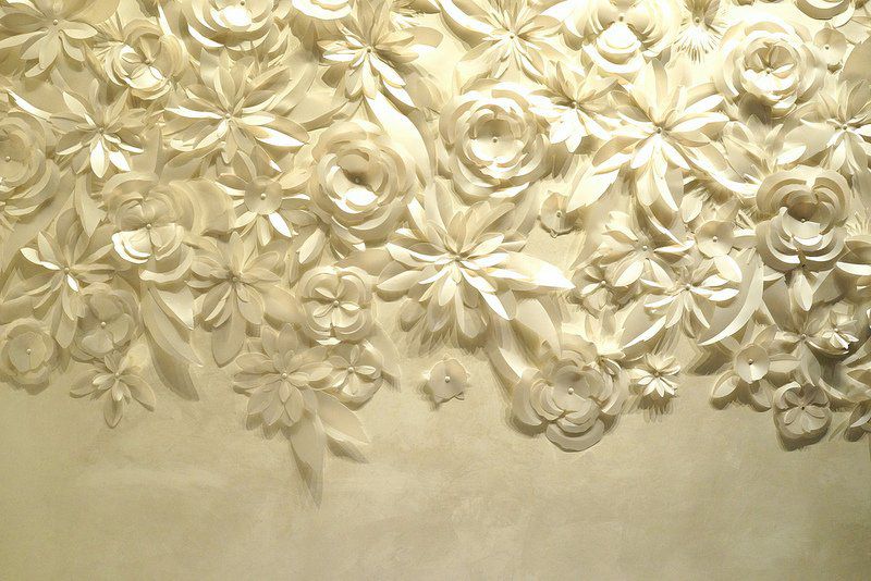 Next we can check out the spa, gym, and pool. There are hand-crafted camellias wall to wall, lining the way.<br/>
